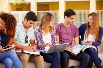 High School Students Collaborating On Project On Campus