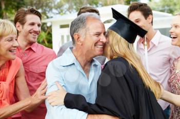 Female Student And Family Celebrating Graduation