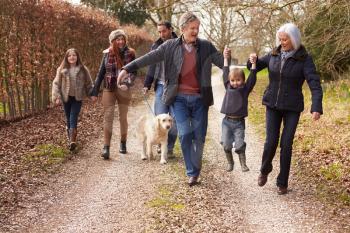 Multi Generation Family On Countryside Walk