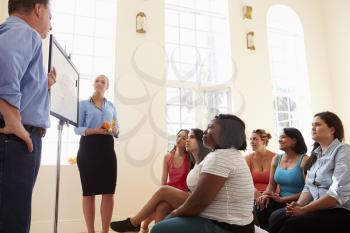 Group Of Overweight People Attending Diet Club