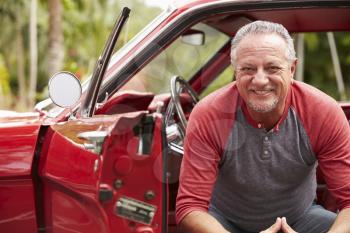 Retired Senior Man Sitting In Restored Classic Car