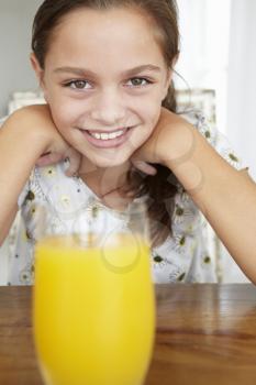 Young girl with orange juice