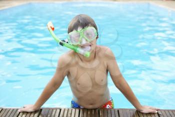 Boy in outdoor swimming pool