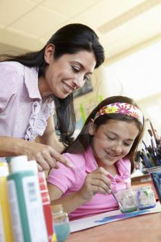 Teacher and pupil in art class