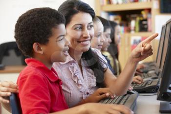 Teacher and schoolchildren in class