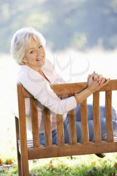 Senior woman sitting outdoors