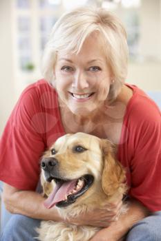 Senior woman at home with dog