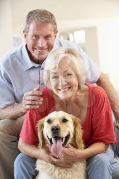 Retired couple at home with dog