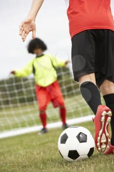 Boy goalkeeper braced for penalty shot