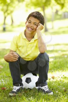Boy in park with football