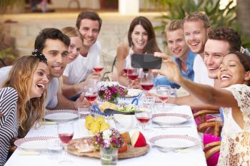 Group Of Friends Taking Selfie During Lunch Outdoors