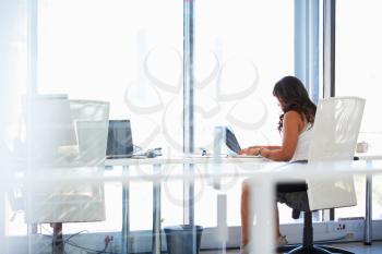 Woman working alone in an office