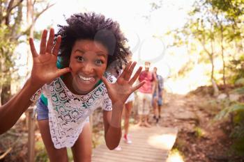 Woman On Walk With Friends Making Pilling Face At Camera