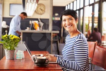 Woman using computer, portrait