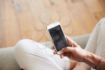 Close Up Of Woman Using Smartphone At Home