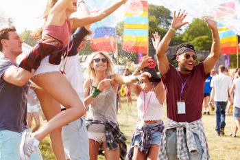 Friends enjoying a performance at a music festival