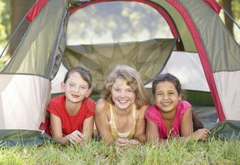 Group Of Girls Having Fun In Tent In Countryside