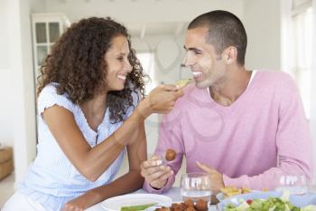 Young Couple Enjoying Meal Together