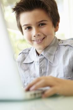 Hispanic Boy Using Laptop
