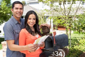 Hispanic Couple Checking Mailbox
