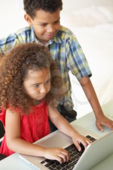 Children Using Laptop At Home