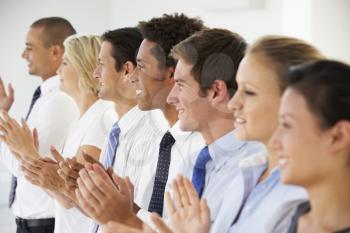 Line Of Happy And Positive Business People Applauding