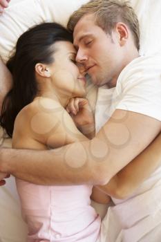 Couple Sleeping In Bed