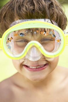 Head And Shoulders Portrait Of Boy Wearing Swimming Mask