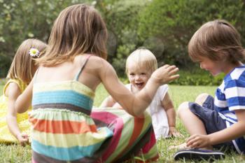 Group Of Children Playing Outdoors Together