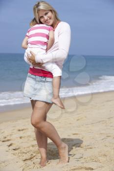 Mother Cuddling Young Daughter outdoors,outside,
