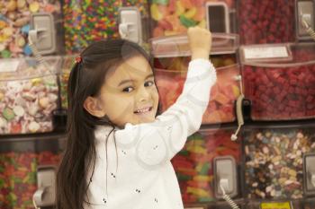 Girl At Candy Counter In Supermarket