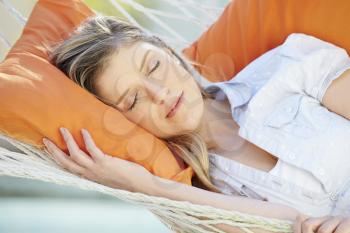 Attractive Woman Sleeping In Garden Hammock