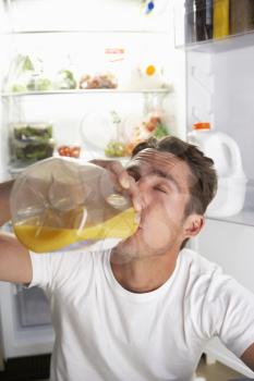 Man Raiding The Fridge For Drink At Night