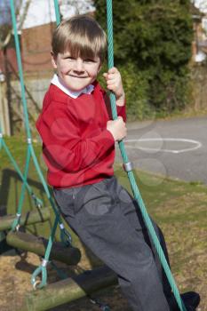 Portrait Of Elementary School Pupils On Climbing Equipment