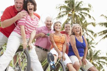 Group Of Senior Friends Having Fun On Bicycle Ride