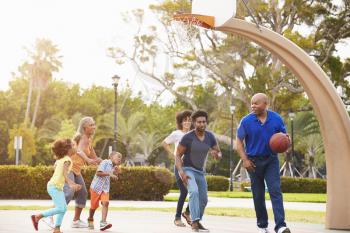 Multi Generation Family Playing Basketball Together