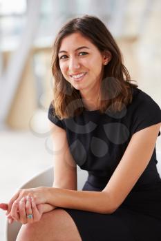 Vertical portrait of young mixed race Asian businesswoman