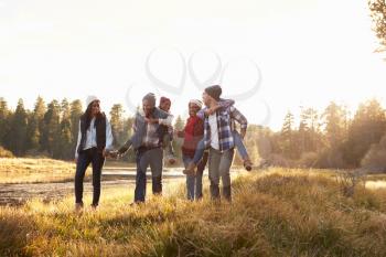 Extended Family Group Walking By Lake