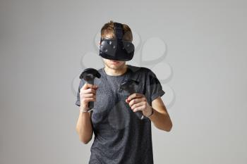 Man In Studio Wearing Virtual Reality Headset Playing Game