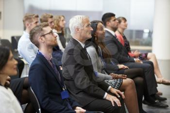 Audience Listening To  Speaker At Conference Presentation