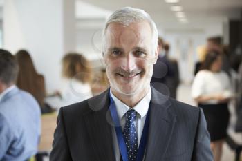 Portrait Of Male Delegate During Break At Conference