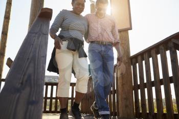 Mature Couple Walking On Observation Platform Together