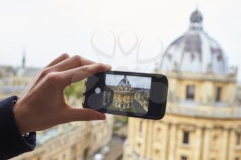 OXFORD/ UK- OCTOBER 26 2016: Tourist Taking Photo Of Radcliffe Camera In Oxford On Phone