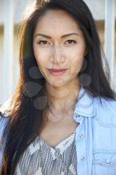 Young mixed race Asian woman outdoors, portrait