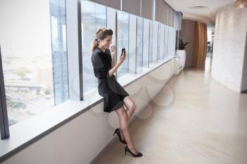 Businesswoman Making Video Call On Mobile Phone