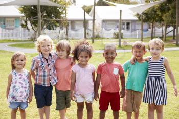 Portrait Of Pupils At Montessori School During Outdoor Break