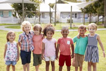 Portrait Of Pupils At Montessori School During Outdoor Break