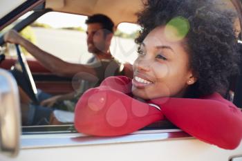 Young Couple Relaxing In Car During Road Trip