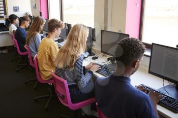 Line Of Teenage High School Students Studying In Computer Class