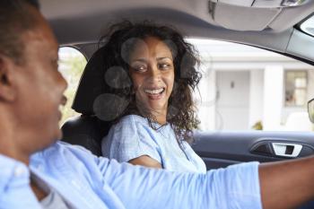 Mature Couple Sitting In Car On Road Trip